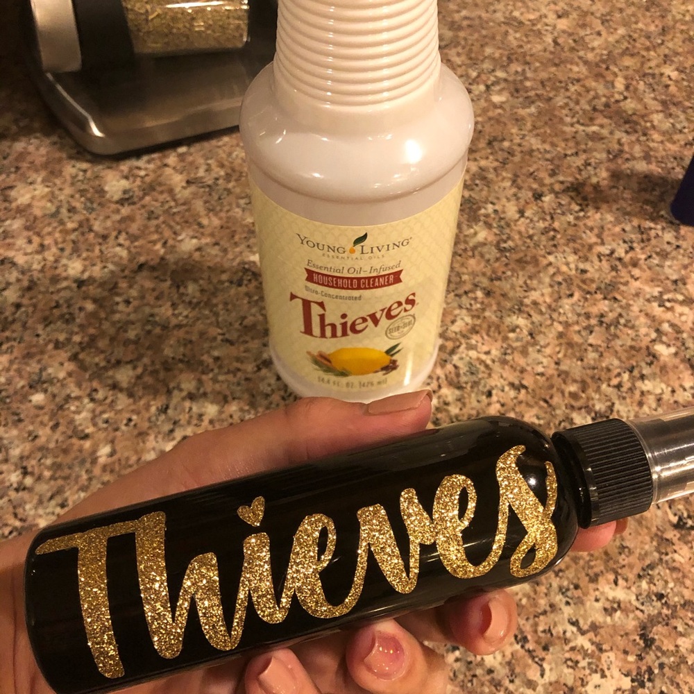 4oz Blue or black with gold Thieves bottle